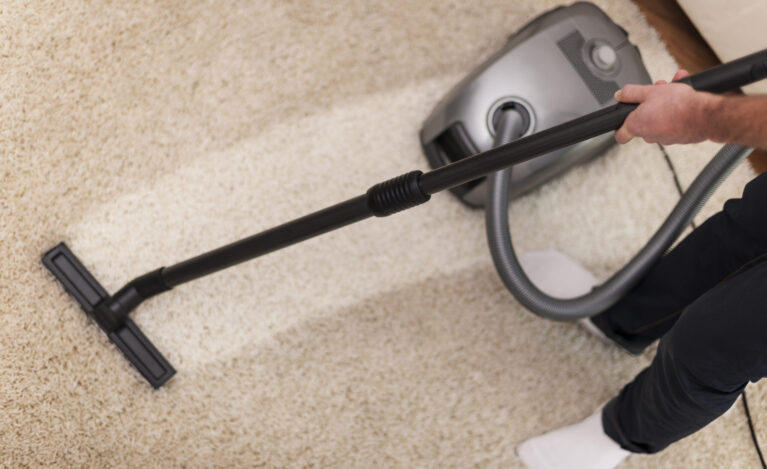 Close up of vacuuming a carpet